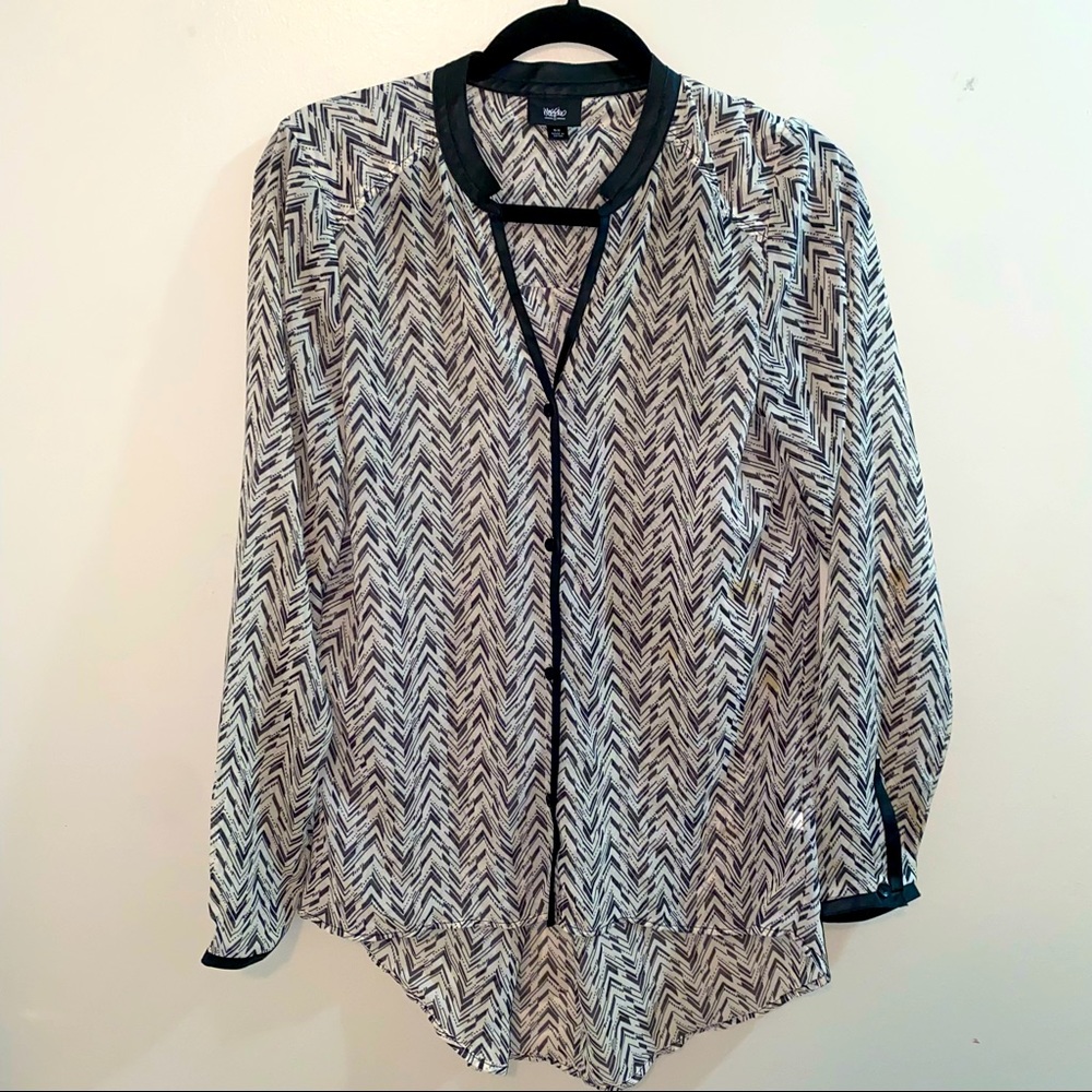 Black and white blouse with leather trim around neck and down sleeves